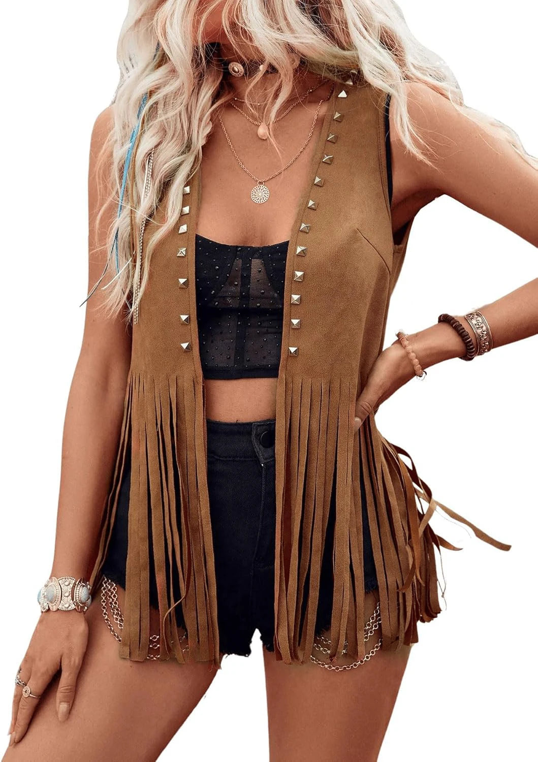 Women’s vintage faux suede fringe vest by Ansoff with rivets, tassels, and open front Western boho style, sleeveless leather jacket.