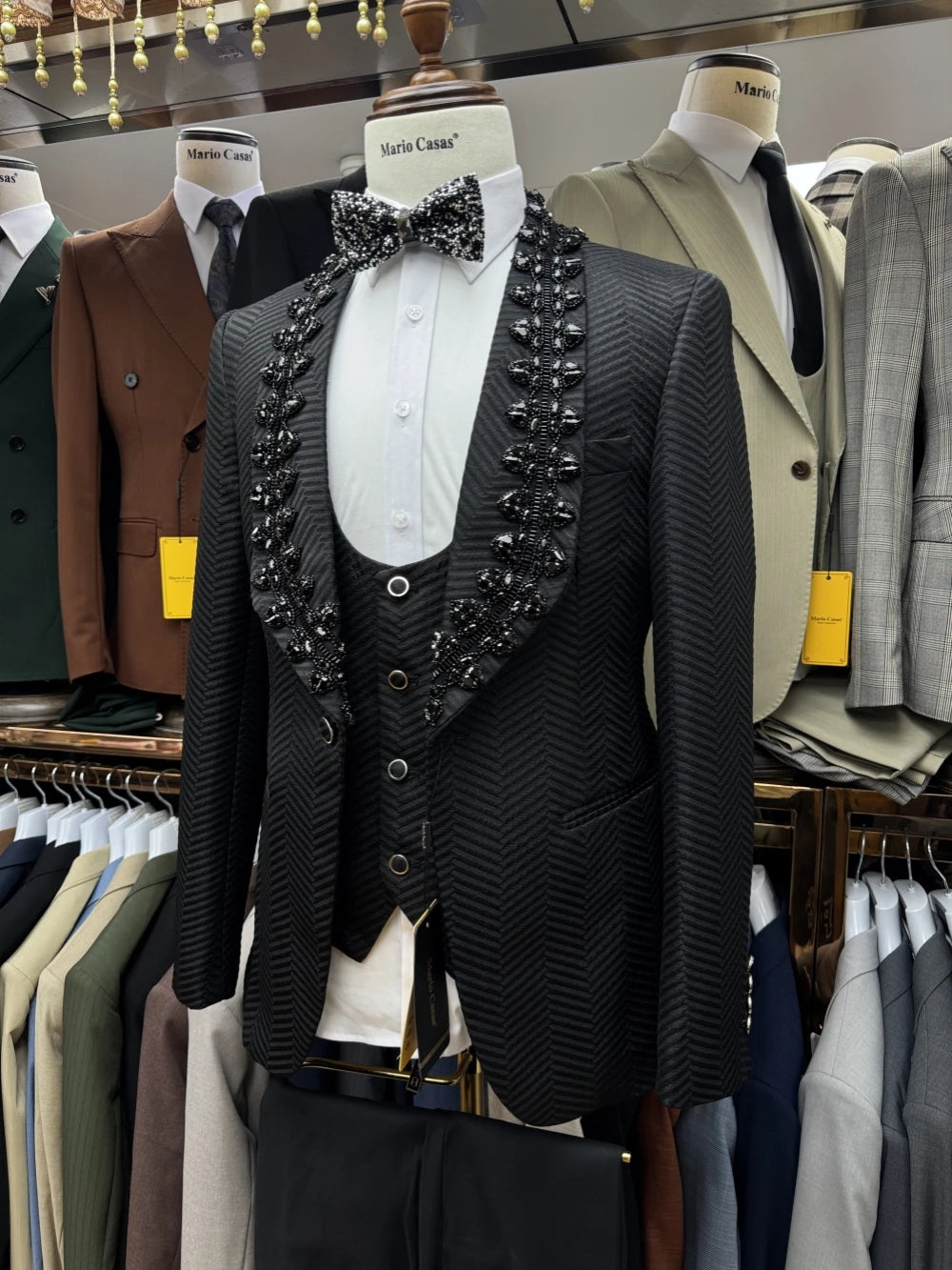 Black beaded men's suit set by Ansoff, includes jacket, vest, and pants, perfect for weddings and parties.