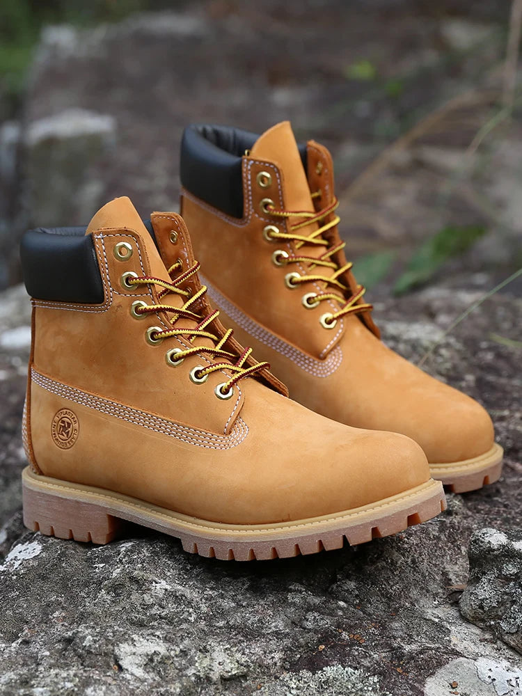 Men's waterproof yellow work boots by Ansoff, featuring durable leather construction and a comfortable fit for outdoor hiking and casual wear.