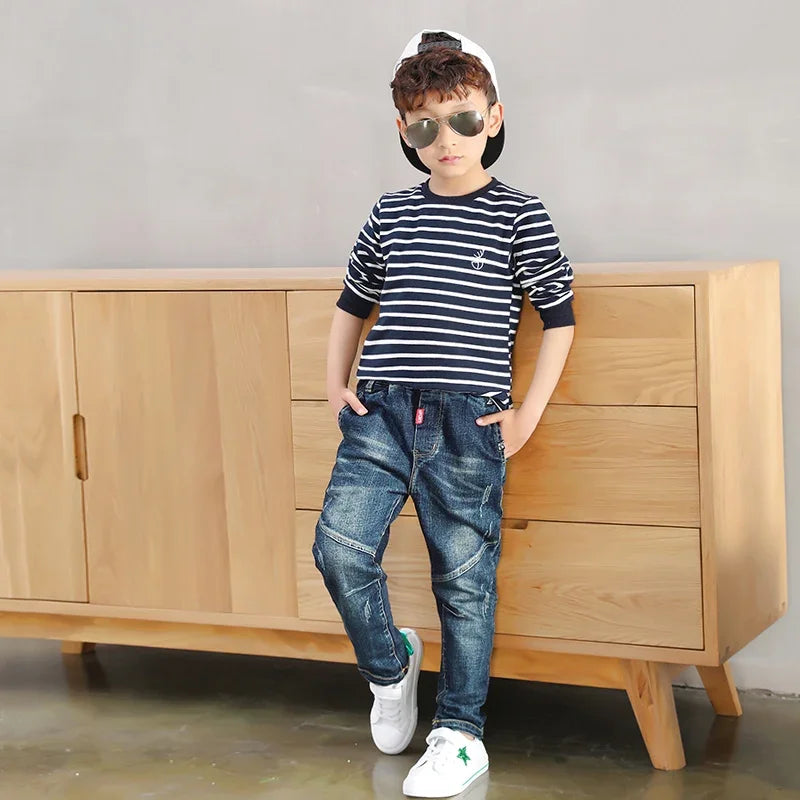 Kids' denim cowboy jeans by Ansoff for boys, size 4 to 12, showing classic blue denim with functional pockets and belt loops.
