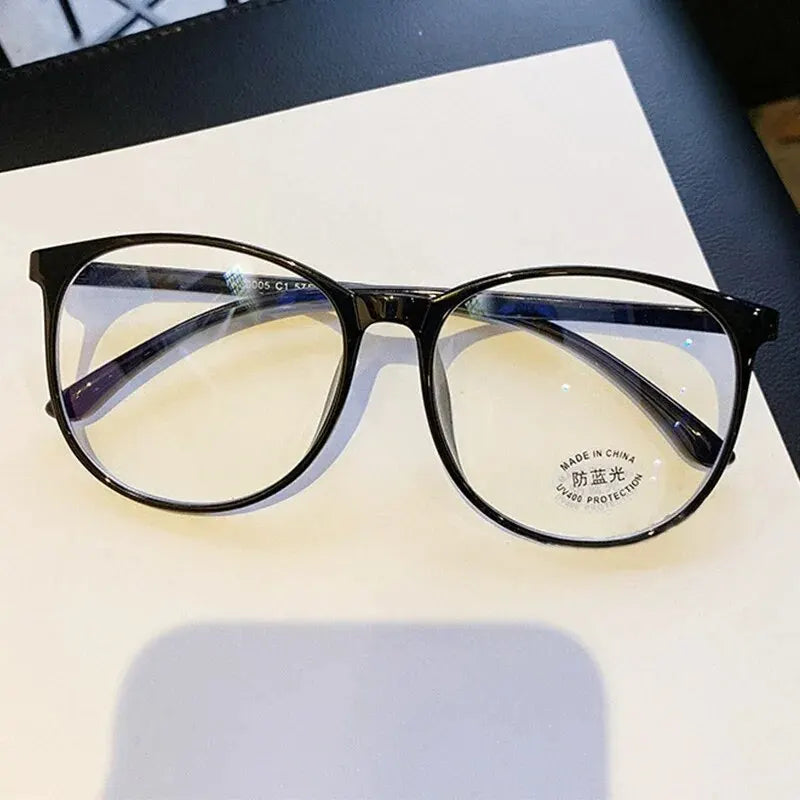 Ansoff clear anti-blue light glasses with replaceable lenses, designed for women and men, reducing digital eye strain.