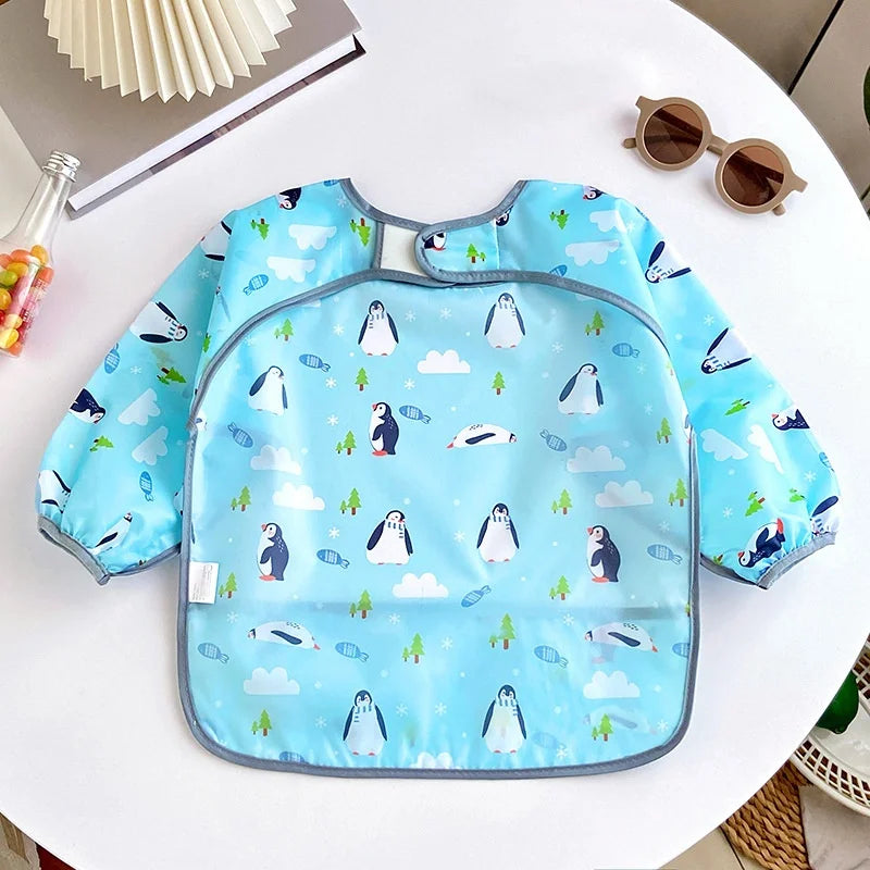 Waterproof cartoon baby bib for girls and boys by Ansoff, long sleeve, adjustable feeding cloth smock for toddlers' meals.