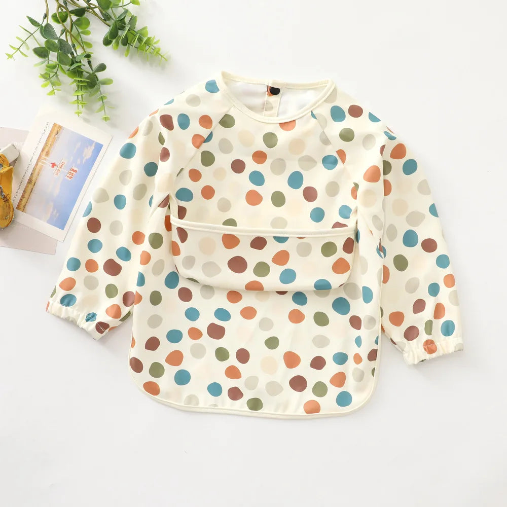 Ansoff infant feeding bibs with long sleeves, printed art design, waterproof material, and front pocket for kids during mealtime.