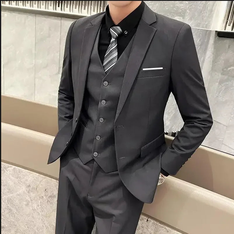 Men's stylish British fashion suit by Ansoff, includes blazer, vest, and trousers in solid color for business or formal occasions.
