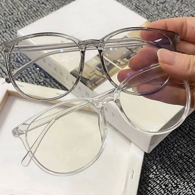 Clear anti-blue light blocking glasses by Ansoff with replaceable lenses, designed for women and men to reduce eye strain from screens.