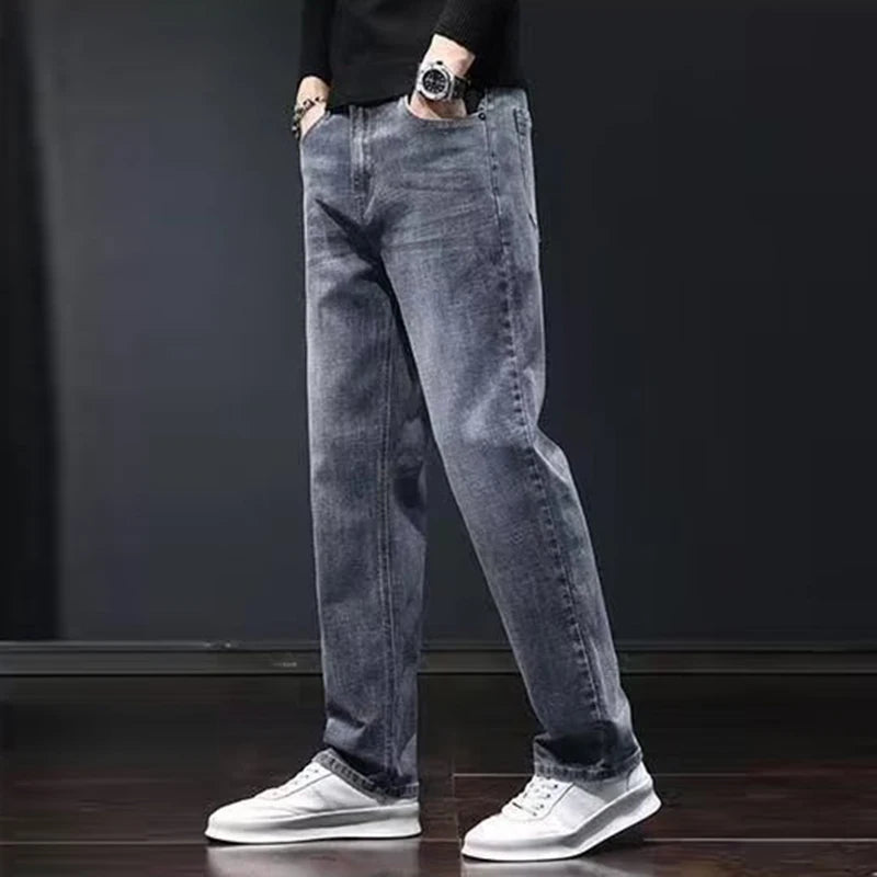 Men's dark gray elastic slim-fit denim jeans by Ansoff with a straight-leg design and wear-resistant fabric, casual style.