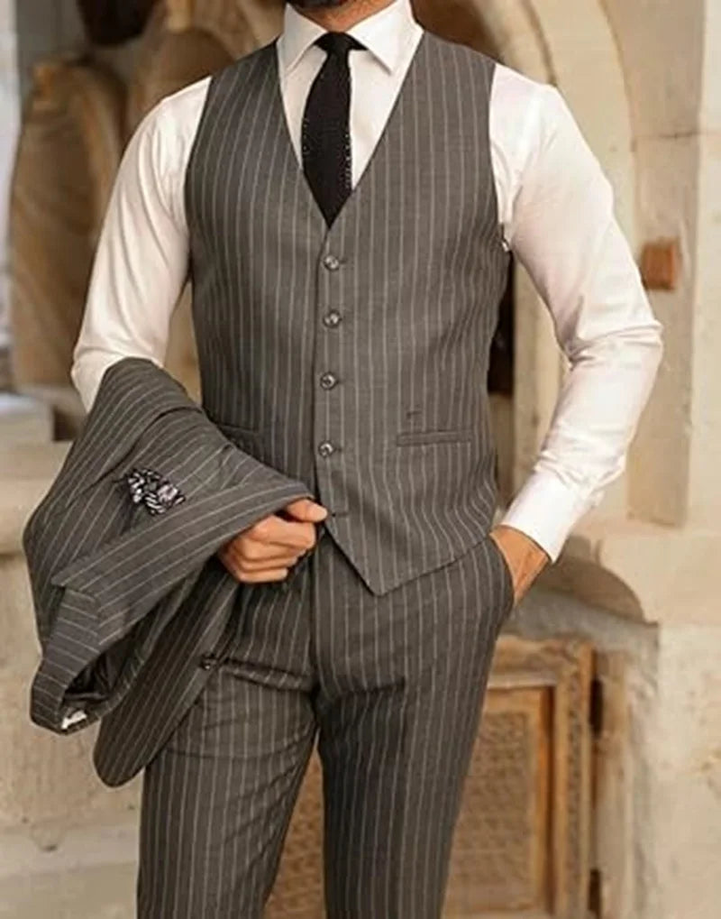 Men's elegant pinstripe 3-piece suit by Ansoff, including blazer, vest, and pants with peak lapels for wedding or business.