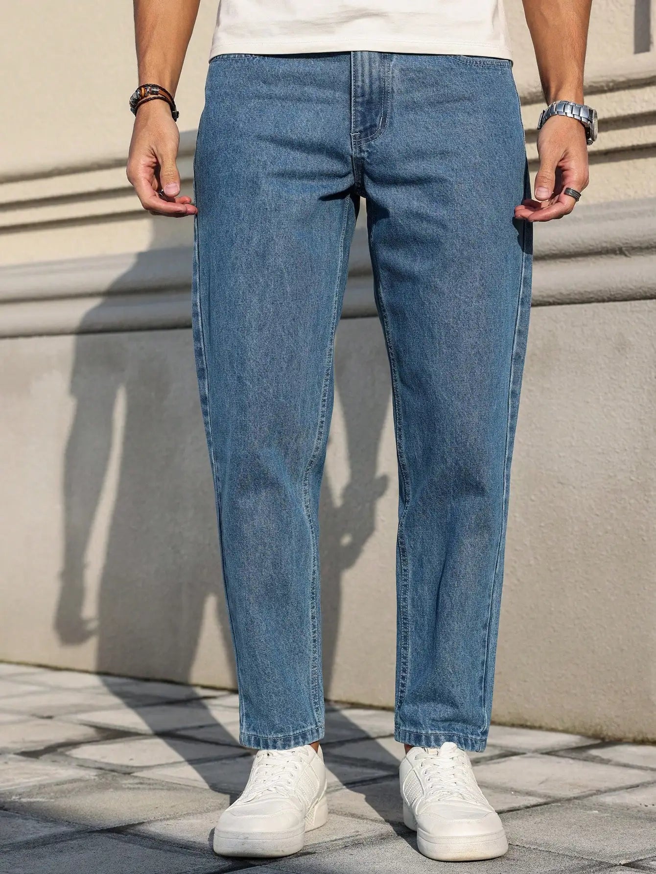 Men's blue denim jeans by Ansoff with a loose fit, showcasing classic fabric and versatile style in a casual wardrobe essential.