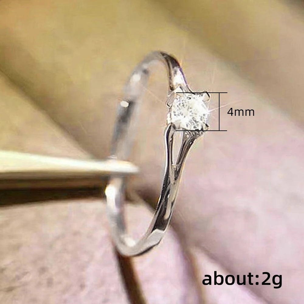 Ansoff Huitan minimalist women's wedding ring with 4mm cubic zirconia, simple elegant jewelry for engagement or finger accessory.