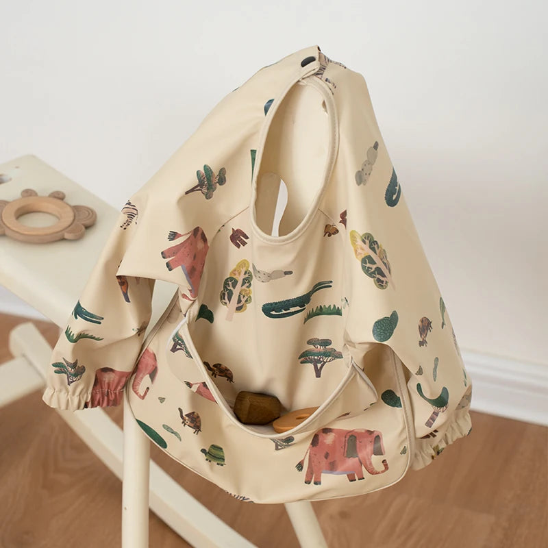 Ansoff infant feeding bibs for children, long sleeve waterproof art smock with pocket, featuring colorful printed design for boys and girls.