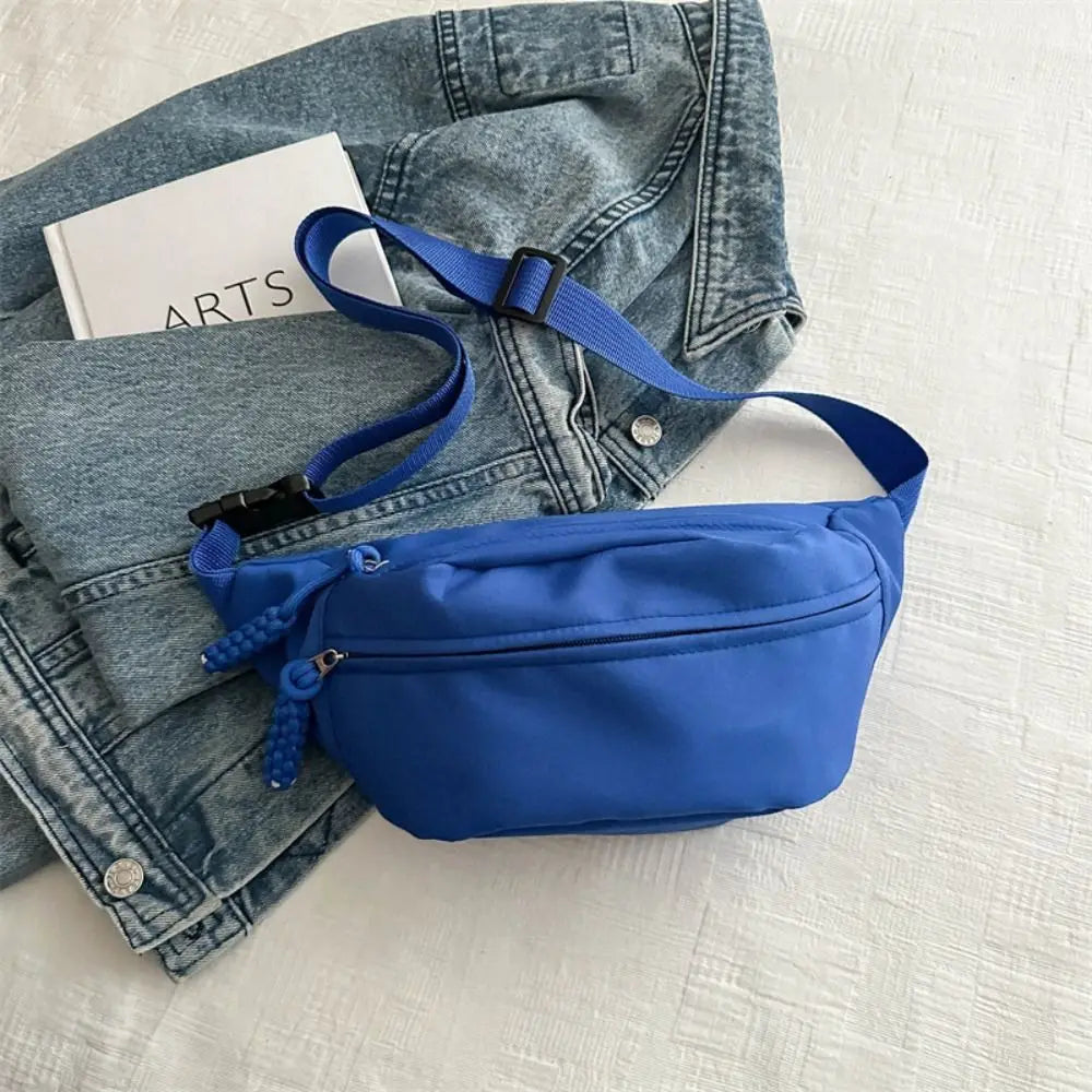 Ansoff large capacity nylon crossbody handbag with belt, casual solid color travel hip bag for students and young couples.