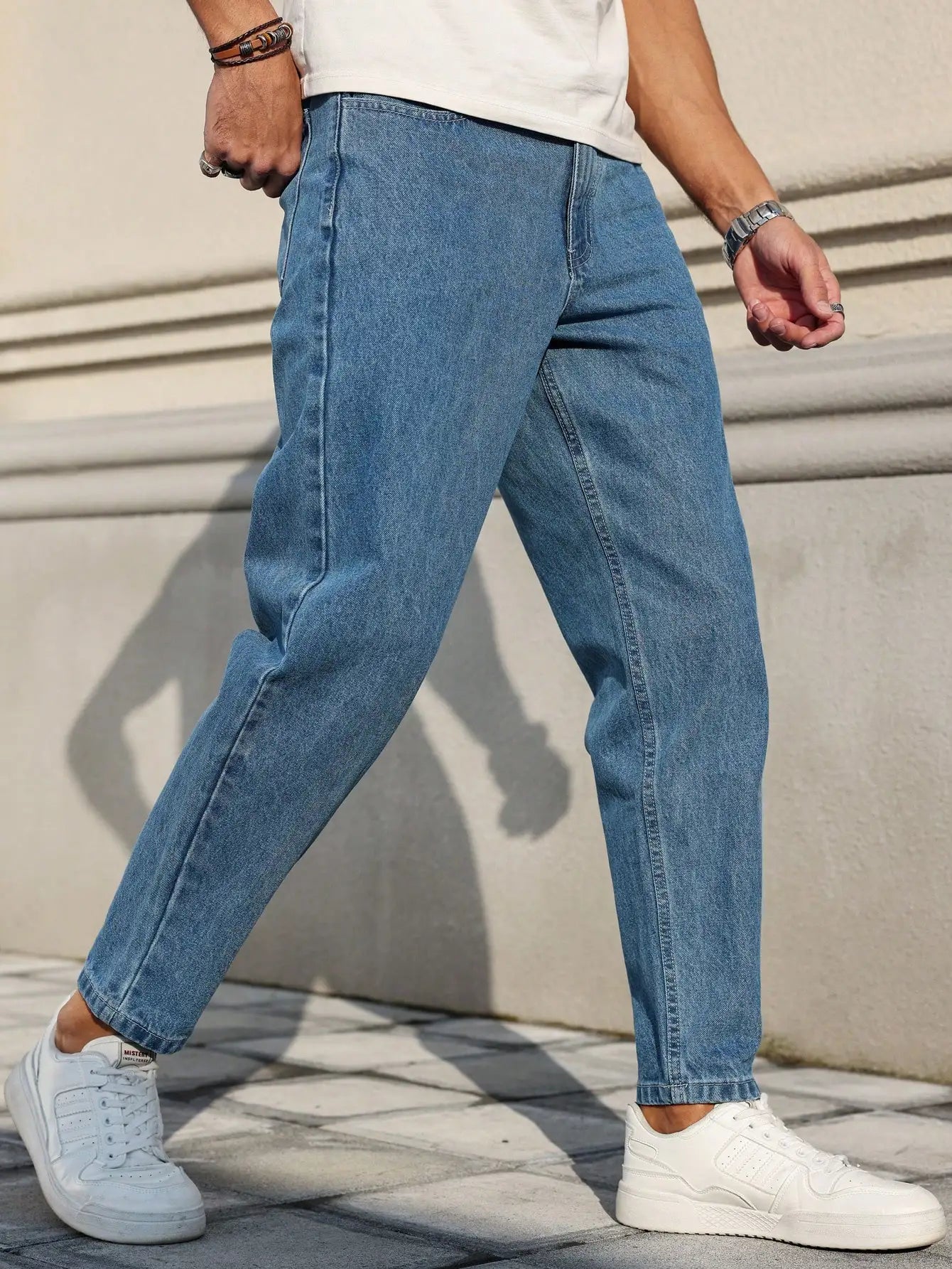 Men's blue denim jeans by Ansoff with a loose fit, showcasing the classic fabric and versatile style suitable for everyday wear.
