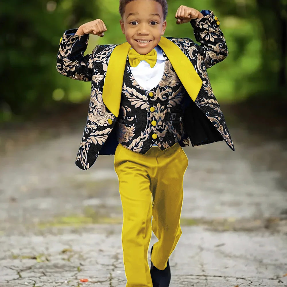 Boy wearing Ansoff slim fit jacquard 3-piece wedding tuxedo suit for celebration, featuring a jacket, vest, and trousers.