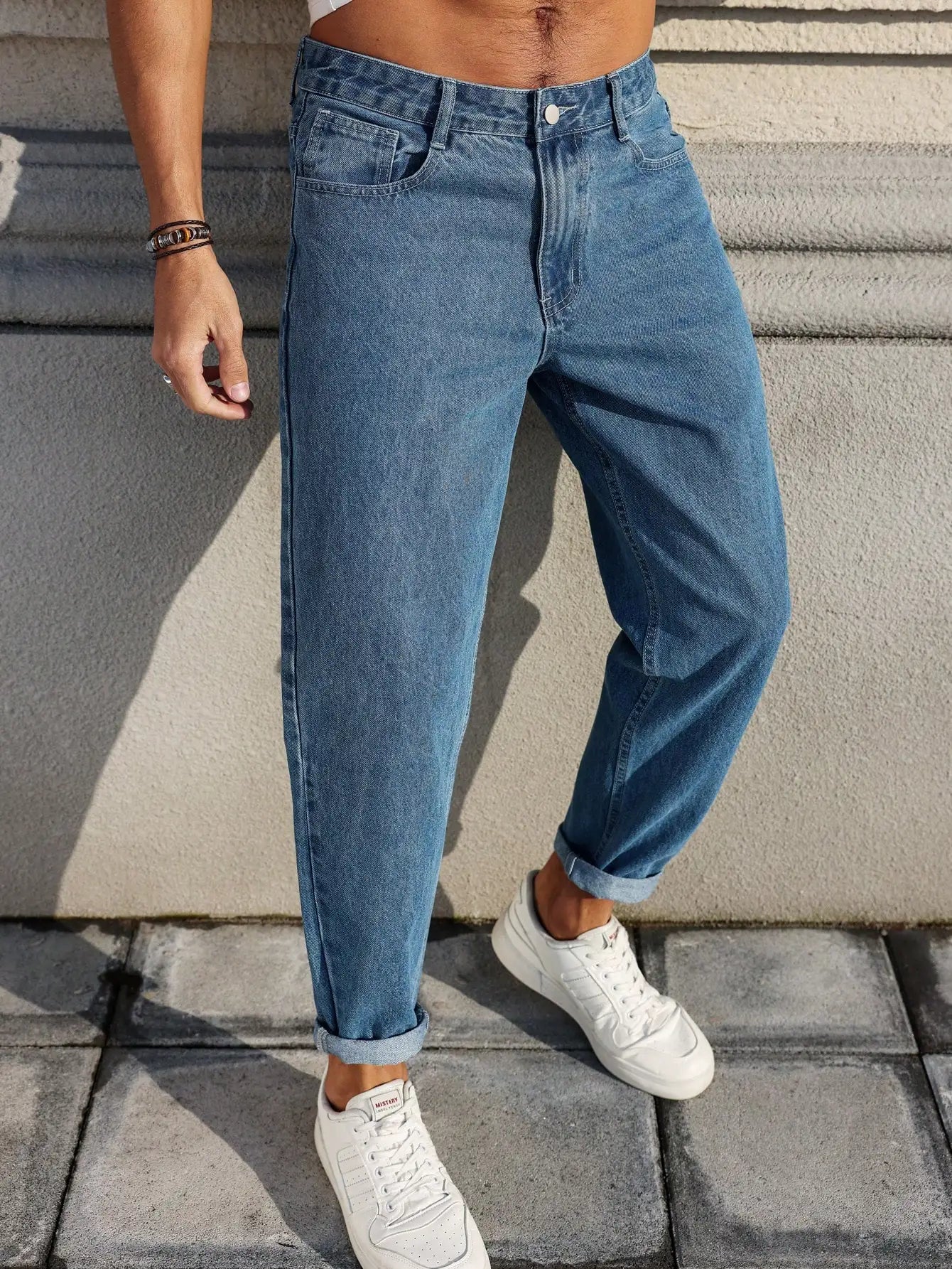 Men's blue denim jeans by Ansoff with a loose fit, showcasing the classic denim fabric and versatile style.