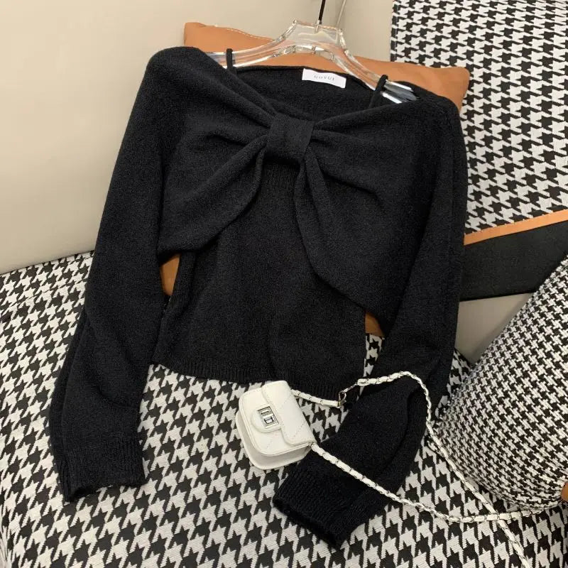 Ansoff women's two-piece sweater suit with long sleeve top and suspender vest in autumn fashion, featuring bow detail and short length.