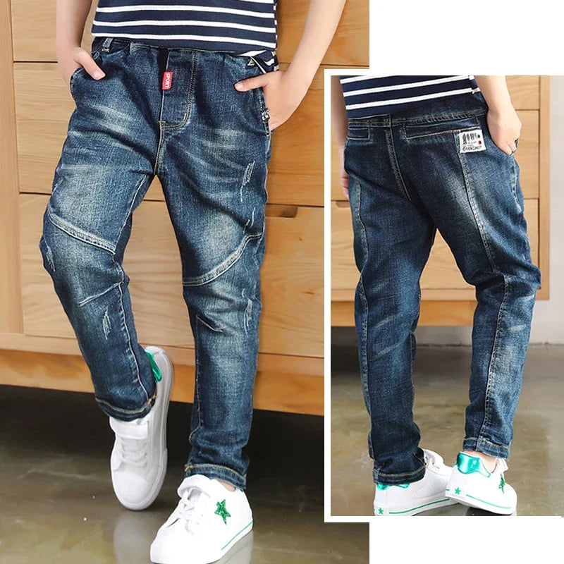 Kids' denim cowboy-style jeans by Ansoff, featuring classic blue denim, for boys aged 4 to 12, suitable for casual wear and outdoor activities.