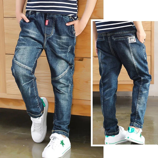 Kids' denim cowboy-style jeans by Ansoff, featuring classic blue denim, for boys aged 4 to 12, suitable for casual wear and outdoor activities.