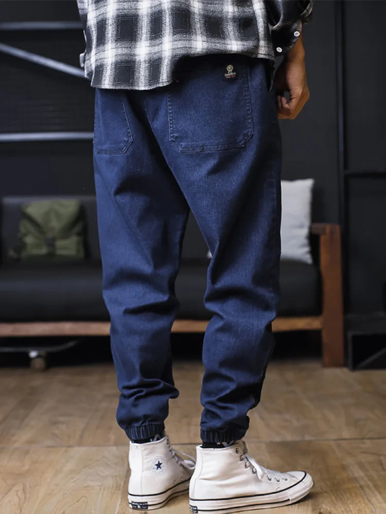 Plus size men's loose jogger jeans by Ansoff, featuring streetwear harem style cargo pants and ankle-length denim trousers.