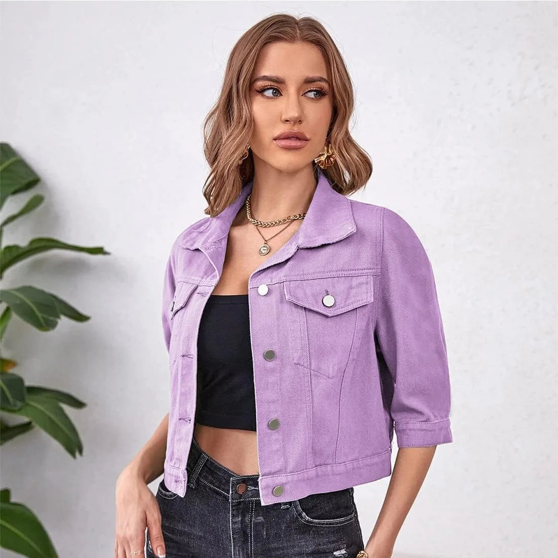 Ansoff women's cropped denim jean jacket with puff sleeves, distressed details, purple yellow white blue colors, and front pockets.