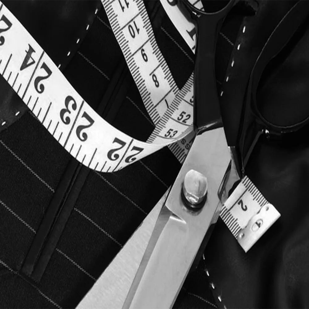 Men's 2-piece Ansoff tuxedo with one-button peak lapel, suitable for parties and dinners, shown in a formal black suit.