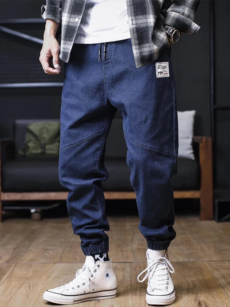 Plus size men's loose jogger jeans by Ansoff, featuring harem-style cargo denim trousers with ankle-length fit.