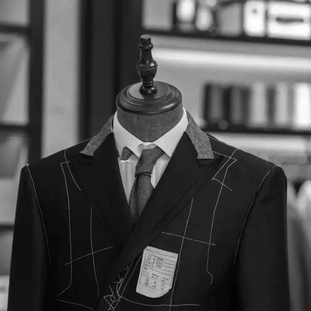 Men's Ansoff 2-piece suit with one-button peak lapel, perfect for parties and dinners, shown in black fabric.