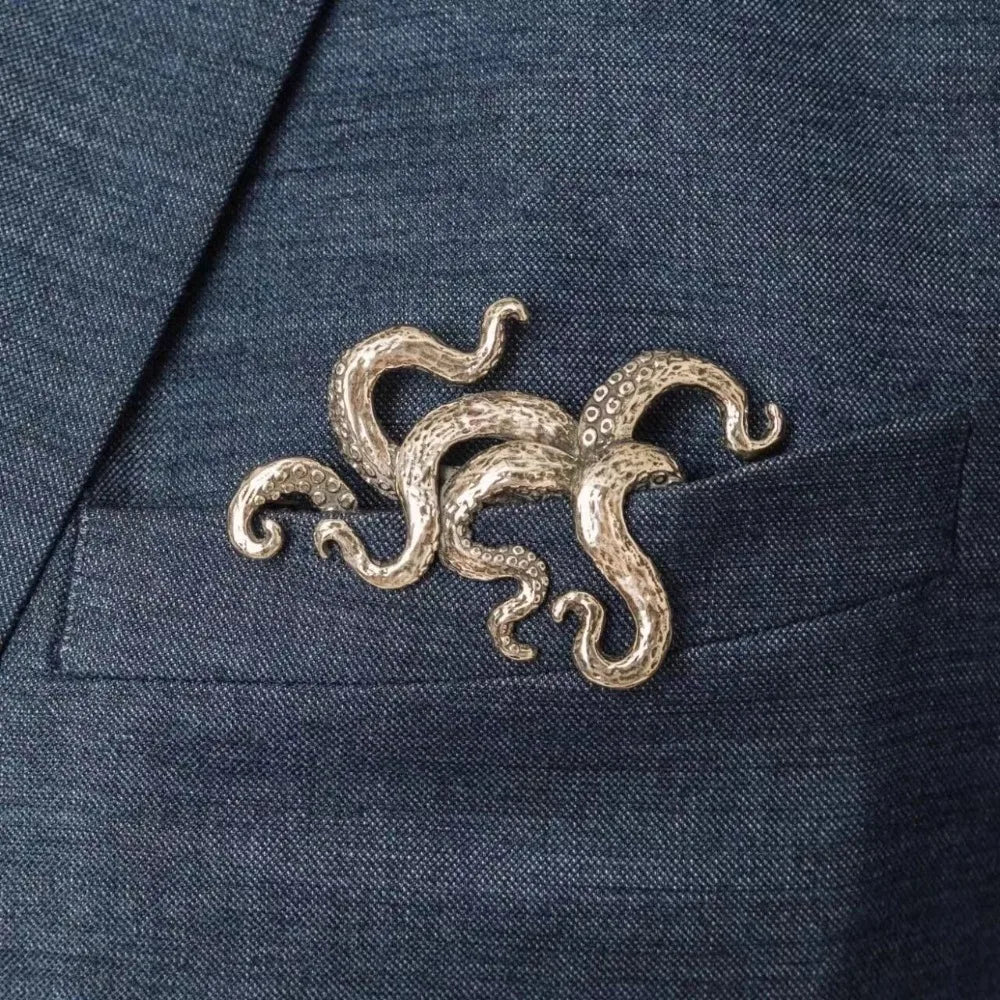 Ansoff crocodile, tiger, and octopus animal brooches for men and women, vintage-style jewelry on a suit coat neckline.