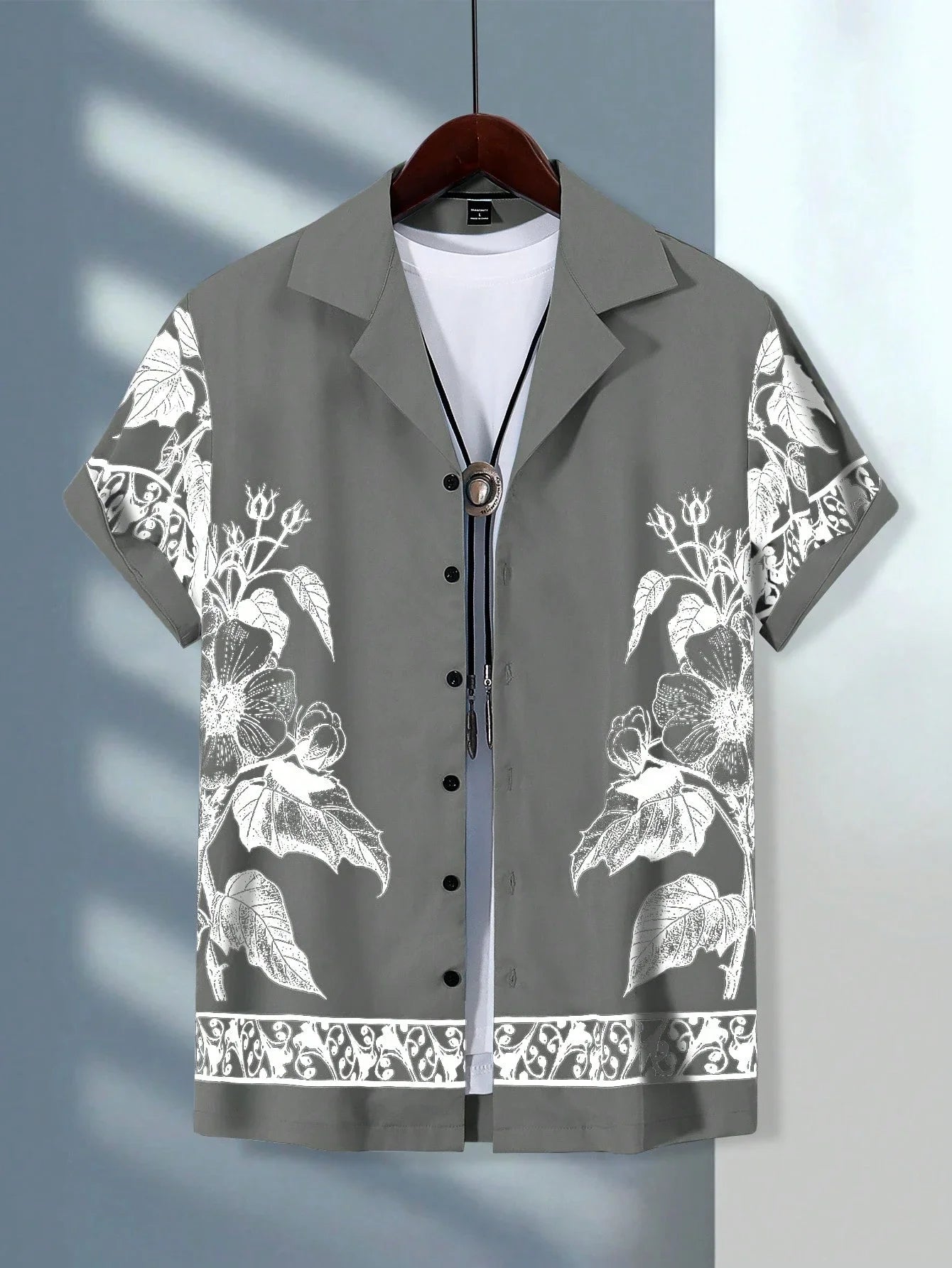 Men's Hawaiian short sleeve shirt by Ansoff featuring colorful vacation print and casual button lapel design.