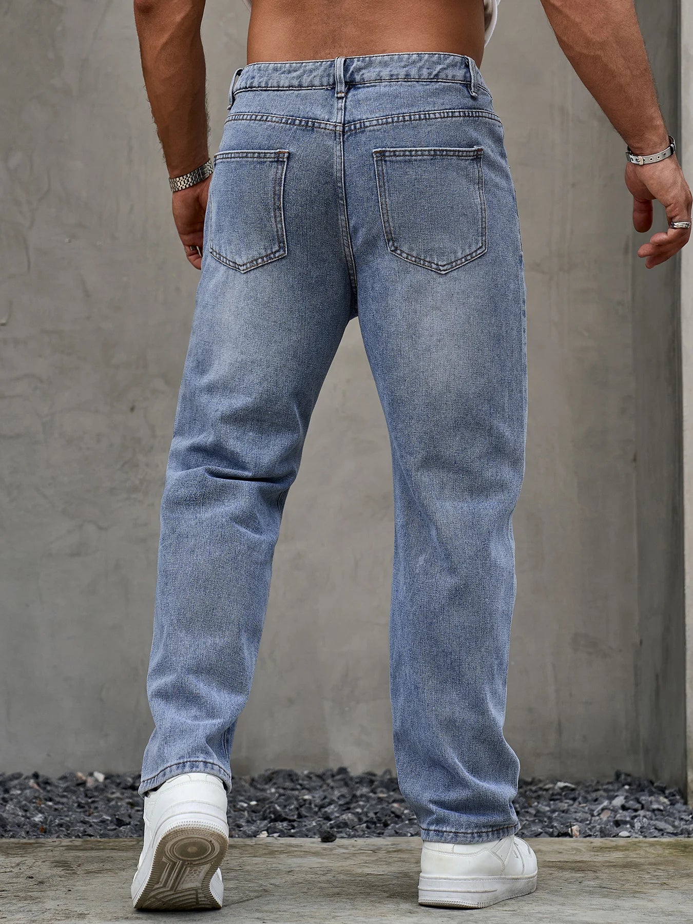 Men’s blue denim jeans by Ansoff, loose fit casual straight-leg trousers with durable, soft fabric for versatile all-season wear.