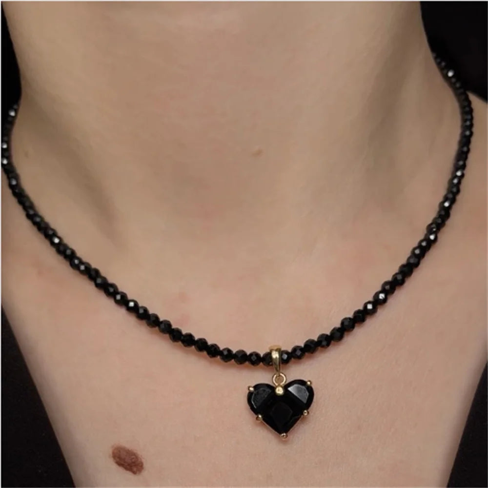 Vintage zircon heart pendant necklace for women by Ansoff, featuring boho geometric design with transparent crystals on a chain.